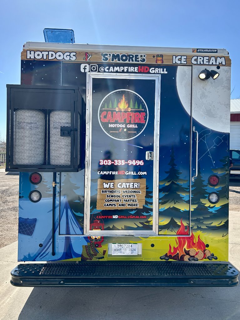 Rear view of the Campfire Hotdog Grill truck with menu highlights.