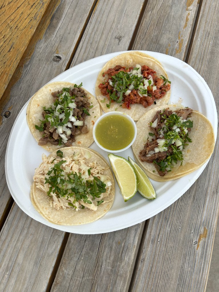 Street-style taco plate with chicken, carnitas, al pastor and steak.
