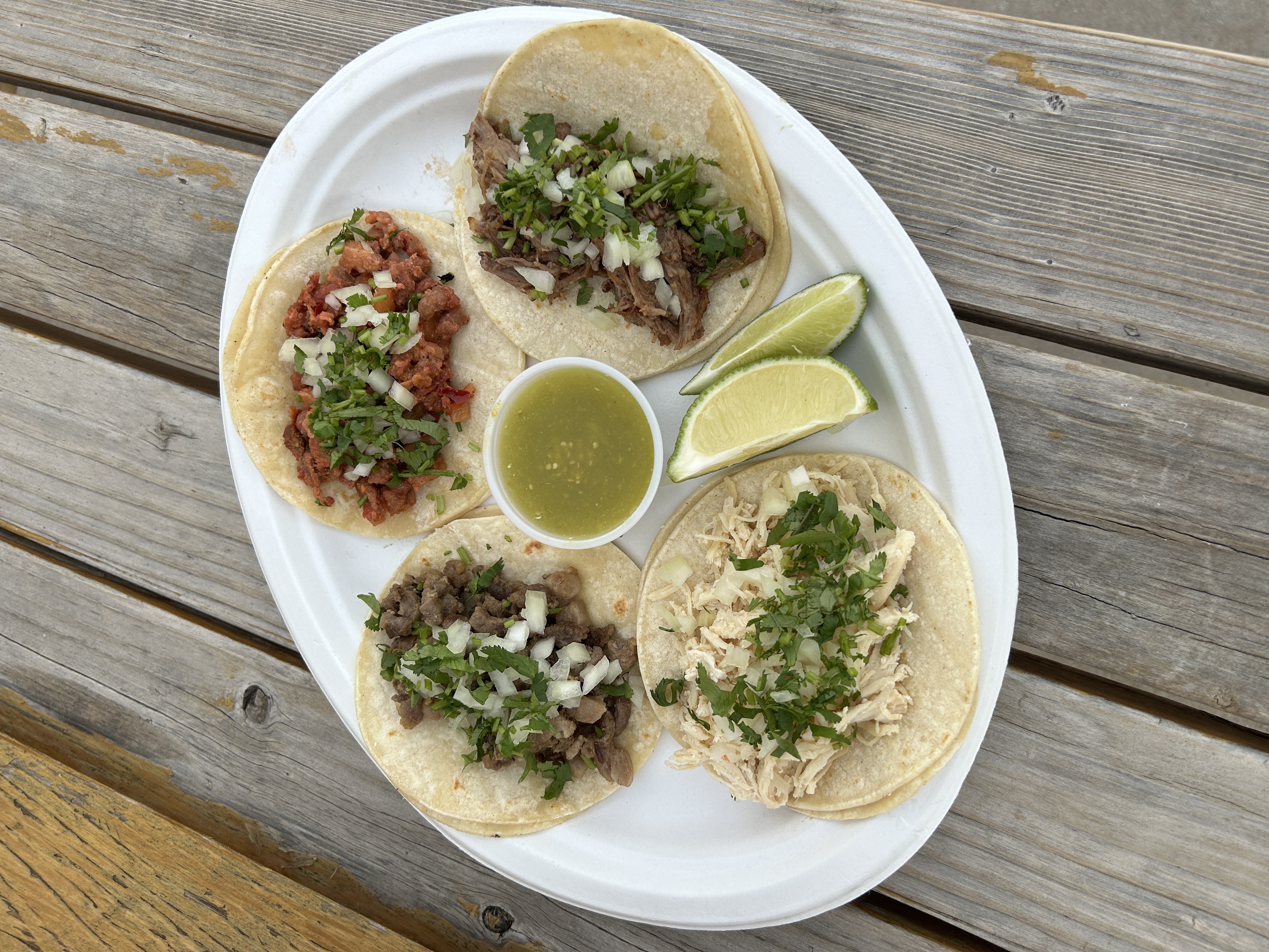 A delicious selection of tacos with fresh ingredients and lime.