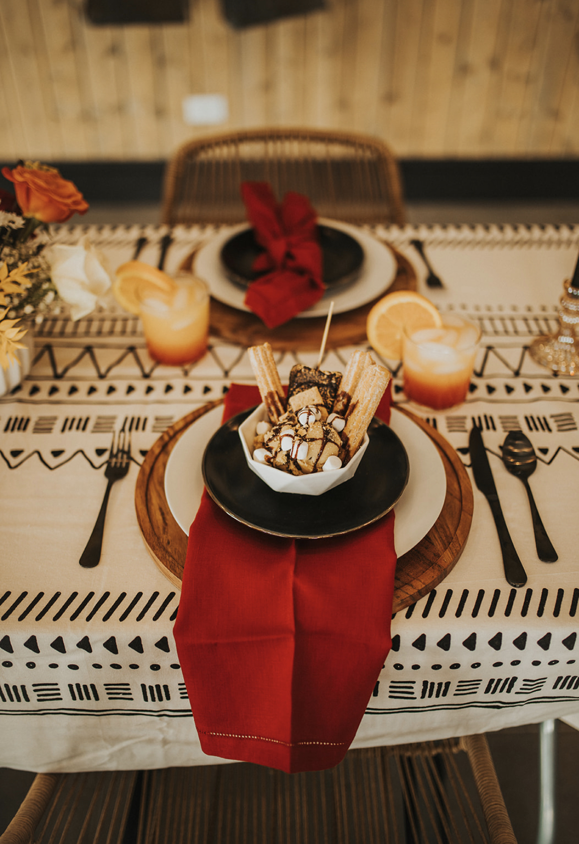 Elegant dessert setup featuring churros and sweet treats.