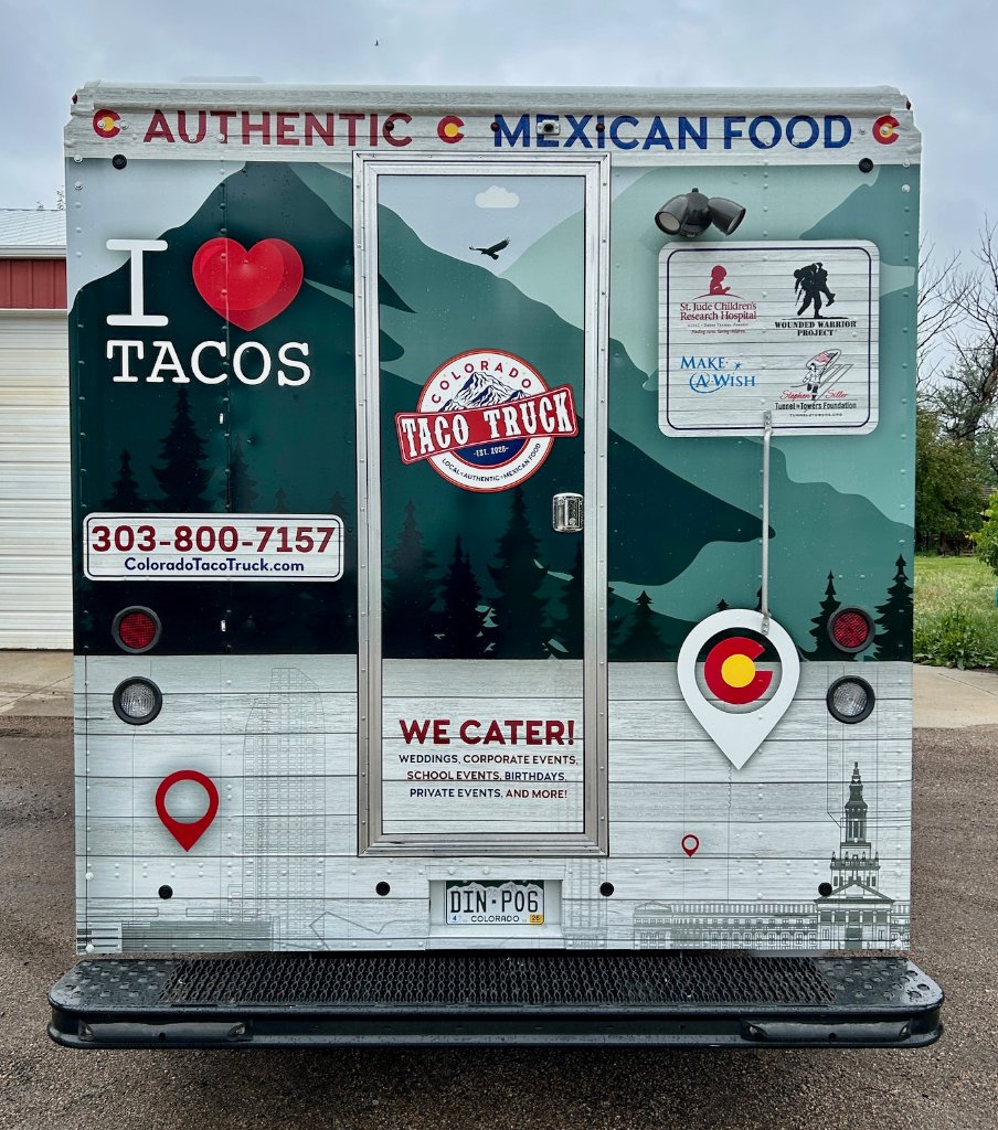 Back view of the Colorado Taco Truck with branded mountain artwork.