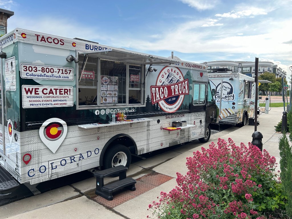 Colorado Taco Truck and Snowy Churro parked side-by-side at a residential community event.